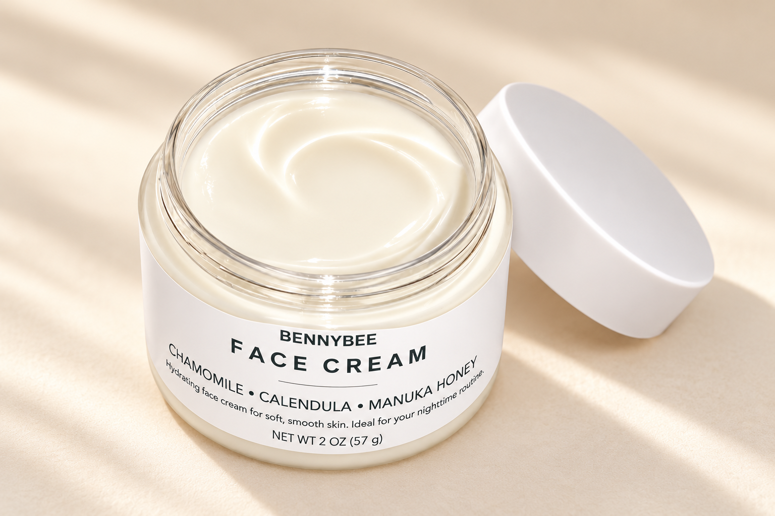 Open BennyBee Face Cream jar showing its smooth cream texture.